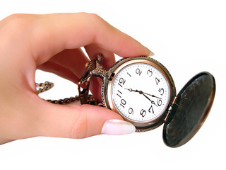 Hand with old golden clock on white background