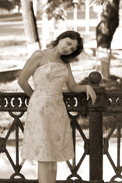 Sepia photo of a woman in a dress