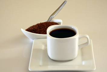 cup of black coffe and brown sugar