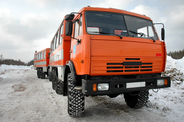 orange truck working, industrial activity, winter hature