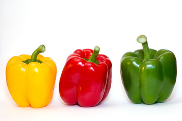 three bell peppers on white