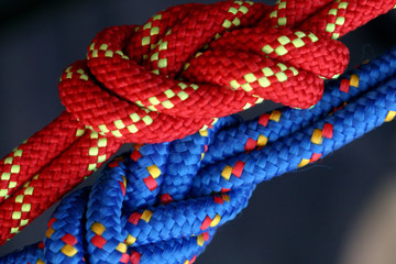 Two figure eight follow through knots in a climbing rope.
