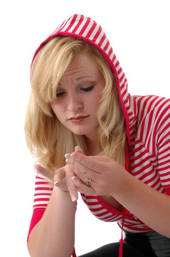 A Young Woman Inspecting A Hangnail 