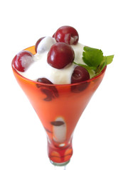 dessert in glass isolated on white(cherry with cream)