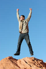 Obraz premium Ecstatic businessman jumping in the air
