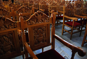 Church pews in order from a christian churchin Greece.