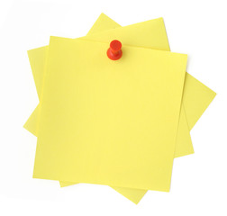 three yellow sticky notes thumbtacked to white background