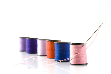 needle-work in different colors threads