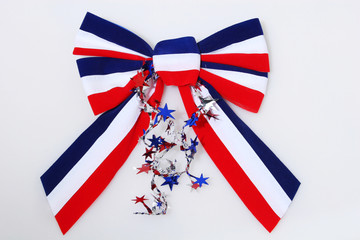bow and ribbon in US flag colors, holiday decoration