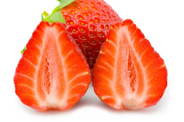 the two halfs and one full strawberry on white background