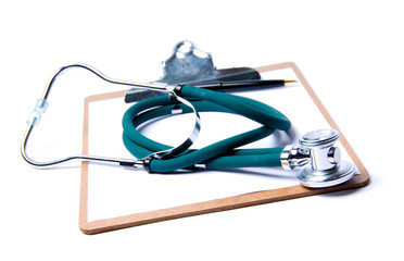 Stethoscope in green on clip board on white
