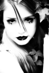 Beautiful 14 year old teen in goth make-up outside.