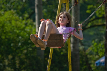 happy girl swinging