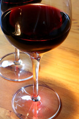 Red wine on an old wooden table