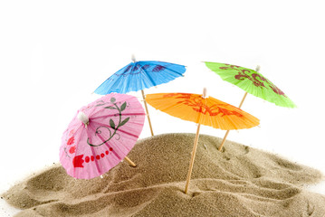 tropical beach with colorful paper parasols