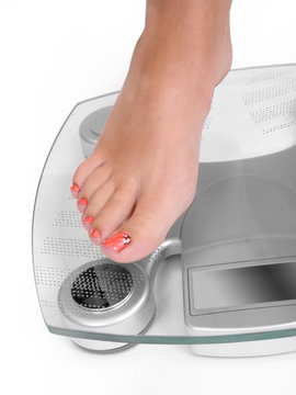 Foot on a bathroom scale - Isolated