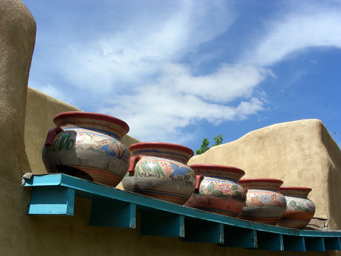 Old clay pots on the roof of an adobe building in New Mexico