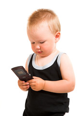 Young child with a phone isolated on the white background