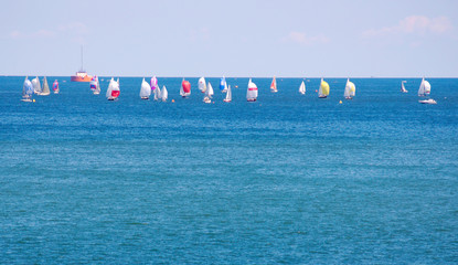 Colorful sailboats participating in a race on Lake Erie