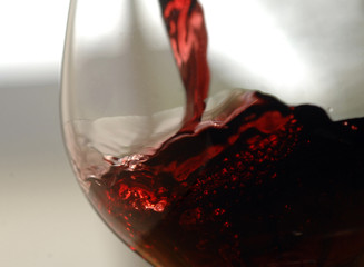 closeup of pouring red wine