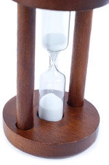 Old fashioned sand clock isolated over white background