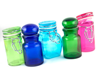 5 colourfull jars on a white background