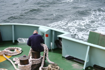 crew member with thick rope
