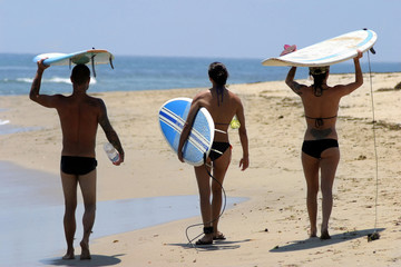 California youth on the beach ready for surfing