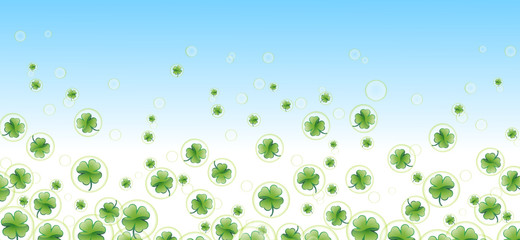 more four-leafed clover in bubbles with blue  background