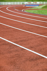 Stadium and running track, hurdle in background