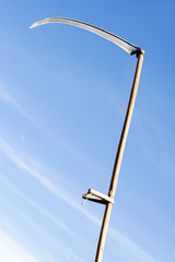 raised for stab sharpen scythe on sky background