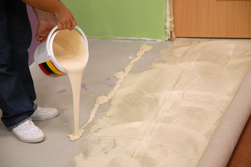 pouring special glue for carpet
