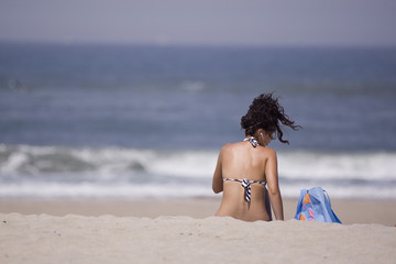 girl seated in the beach