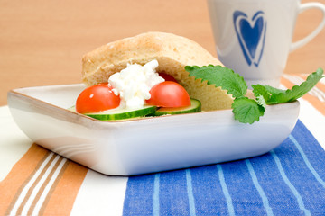 Healthy breakfast bun with a cup of coffee