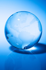 Glass world globe in blue tone