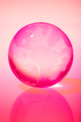 Glass world globe in pink tone