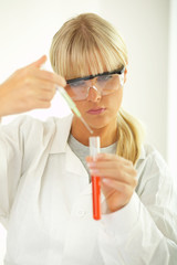 Female lab worker testing and experimenting