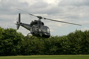 Foto op Plexiglas helikopter tijdens de vlucht © Christopher Nolan