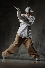 Nightclub dancer posing on a dark background