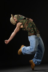 krump style dancer jumping on leg