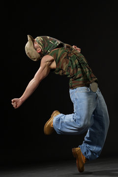 krump style dancer jumping on leg