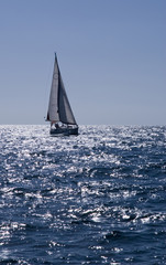 Yacht sailing in blue see