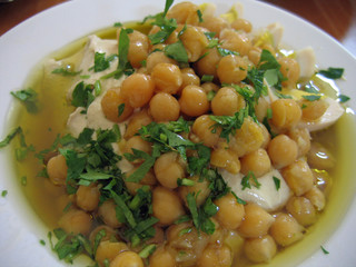 Dish of fresh Hummus in close up - Middle East food