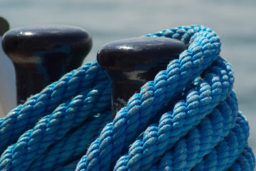 blue rope and black bollards