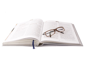 Obraz premium open book and glasses