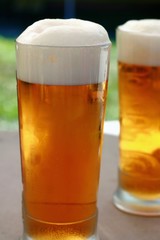 Glass of beer with froth 