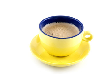 coffee creme in a yellow cup and saucer