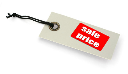 close-up of a Sale tag against white, a small shadow under it,