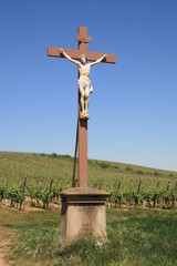 Fototapeta na wymiar Jesus on a cross in a vineyard in Alsace, France