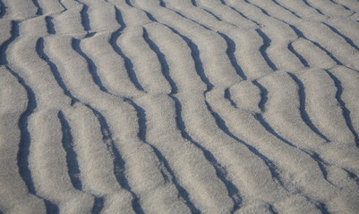 Fototapeta na wymiar beige abstract sand on beach background texture
